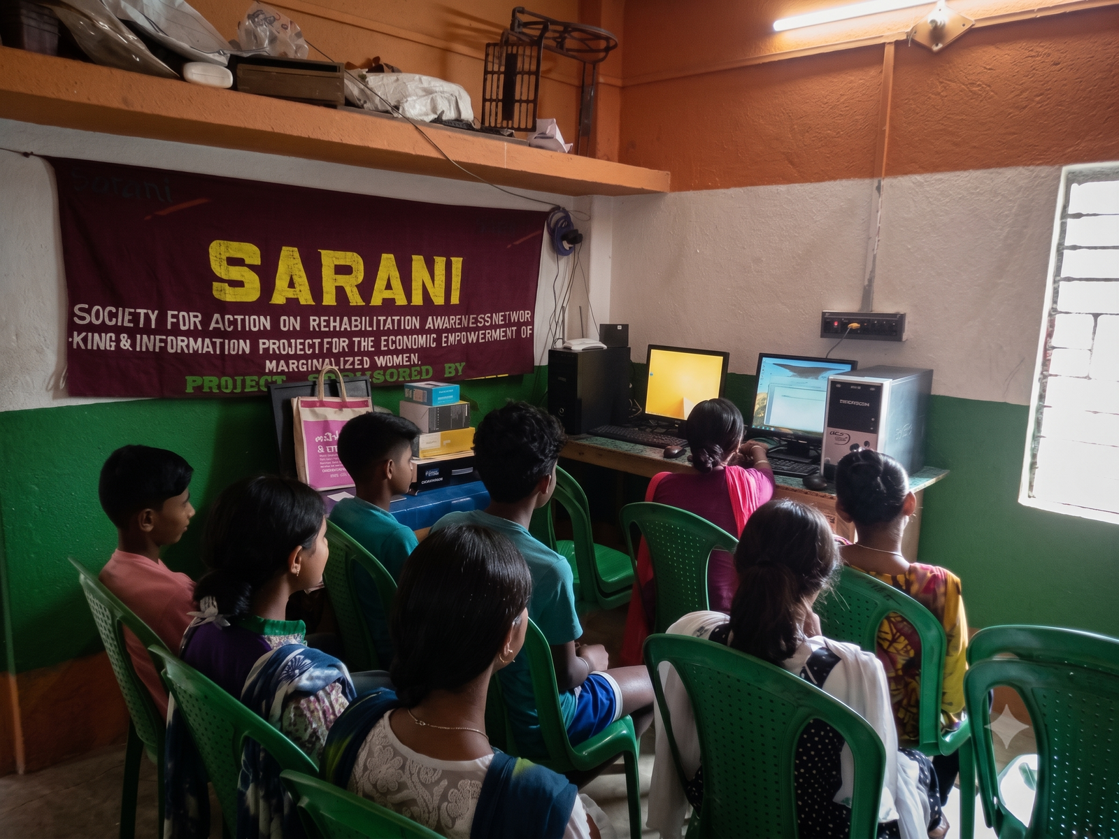 A trainer guiding women in a skills class